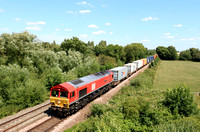 DB Cargo Class 66 No 66055 'Alain Thauvette' in red livery at Syston Bypass approaching Syston East Junction on 7.7.23 with 4M79 0800 Felixstowe South Dbc to East Mids Gateway Tml Dbc well loaded Inte