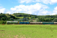 Guest loco Class 25 No D7612 clagging well with 73140 at Pokehill Crossing on 4.8.23 with 1400 Tunbridge Wells West to Eridge service at the Spa Valley Railway summer Diesel Gala 2023 (SMB)