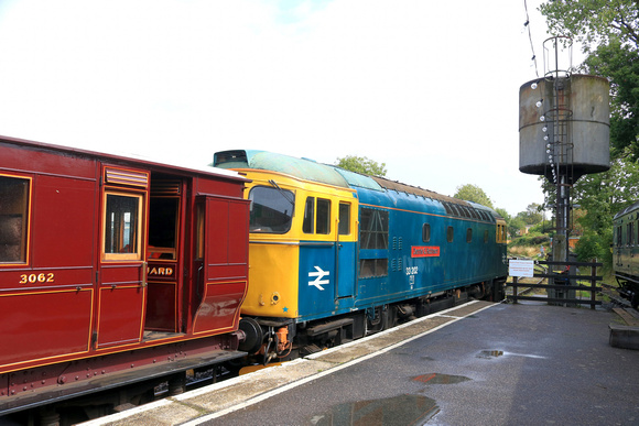 Slim Jim Class 33 No 33202 ' Dennis G Robinson'  with restored brake van 3062 stands at Tenterden Town Station on 5.8.23 having arrived with 0950 Northiam to Tenterden service on the Kent and East Sus