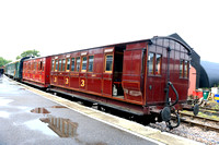 SE&CR coaches No's 2947 & 3062 dating to late 19th century were used as part of a bungalow after withdrawal.  In 1986 K&ESR bought and restored them and on 5.8.23 they are seen at Tenterden Station in