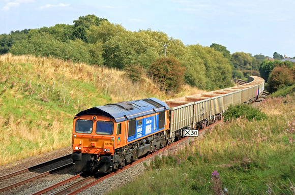 GBR Class 66 No 66731 'Captain Tom Moore' passes through Copley's Cutting near Melton Mowbray on 3.9.23 with 4H10 1225 Wellingborough Up Tc Gbrf to Tunstead Sdgs Gbrf stone empties