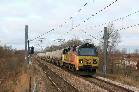 Colas Rail Freight Class 70 No 70802 powers towards Tyne and Wear Metro Fellgate station on 3.3.25 with 6E90 0635 Oxwellmains Lafarge Colas to Seaham Harbour Colas Rail loaded cement tanks