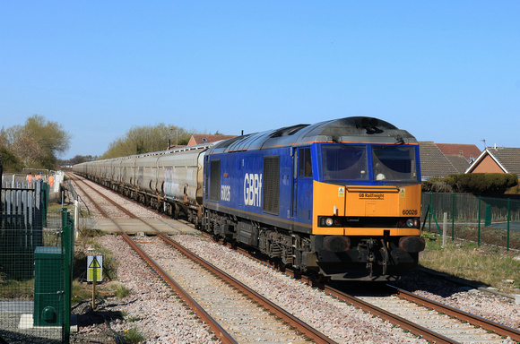 GBRf Beacon Rail blue liveried Class 60 No 60026 Helvellyn approaches Newsham station, Northumberland Line, on 10.4.25 with 6N87 1402 Lynemouth Power Stn (Gbrf) to Tyne Coal Terminal Gbrf empty Biomas