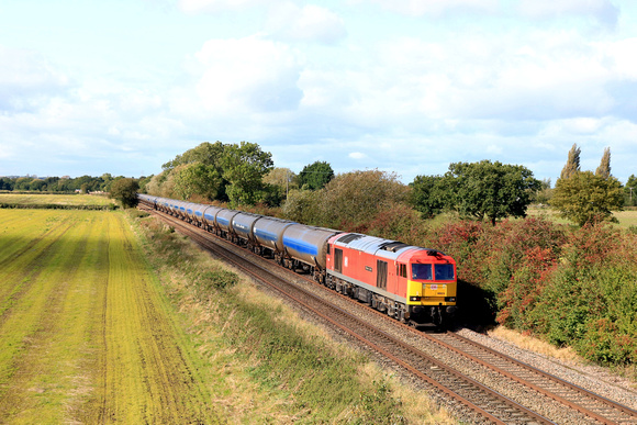 DB Cargo Class 60 No 60024 ' Clitheroe Castle' passes Barrow upon Trent on 3.10.23 with 6E54 1104 Kingsbury Oil Sdgs to Humber Oil Refinery empty oil tanks