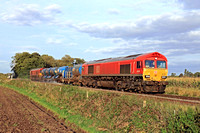 DB Cargo Class 66 No's 66070 and 66185 both in red livery pass East Goscote on 3.10.23 tnt with 3J43 1600 Peterborough L.I.P. to Peterborough L.I.P. RHTT working via Melton Mowbray and Loughborough