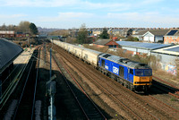 Beacon Rail blue liveried GBRf Class 60 No 60026 Helvellyn passes Tyne and Wear Metro Pelaw station on 19.3.25 with 6N19 0959 Lynemouth Power Stn (Gbrf) to Tyne Coal Terminal Gbrf empty Biomass hopper