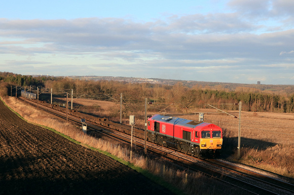An extremely clean DB Cargo Class 66 No 66041 passes Plawsworth near Durham on 3.1.25 with 4E96 0900 Mossend Euroterminal to Tees Dock Bsc Export Berth lightly loaded Intermodal due to the Christmas a