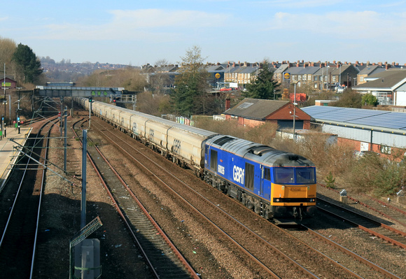 Beacon Rail blue liveried GBRf Class 60 No 60026 Helvellyn passes Pelaw station on 19.3.25 with 6N19 0959 Lynemouth Power Stn (Gbrf) to Tyne Coal Terminal Gbrf empty Biomass hoppers