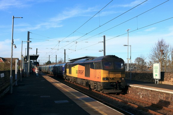 GBRf Class 60 No 60047 Scafell Pike trundles through East Boldon station on 19.11.24 with 6H70 1219 Tyne Coal Terminal Gbrf to Drax Aes (Gbrf) loaded Biomass hoppers
