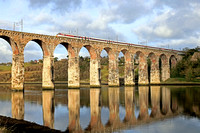 LNER Azuma Class 800 No 800103 sets off across the Royal Border Bridge over the River Tweed at Berwick-upon-Tweed on 21.11.23 with 1E13 0755 Inverness to London Kings Cross service