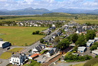 TfW Class 158 units at Harlech station on 14.6.24 158831 2J11 1008 Birmingham International to Pwllheli (left), 158825 2I24 1338 Pwllheli to Birmingham International with the hills of Snowdonia behind