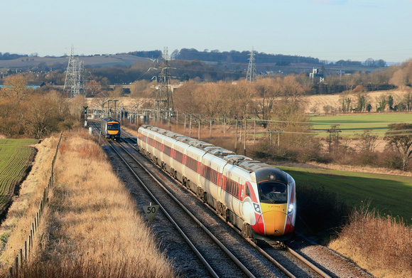 In beautiful winter sunlight and running on diesel power, LNER Azuma Class 800 No 800106 passes  Hillend, nr Dalgety Bay, Fife on 29.11.23 with 1W02 0708 Leeds to Aberdeen service