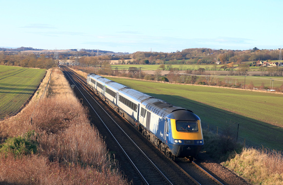 In wicked winter light Scotrail HST Class 43 No's 43033 and 43126 (rear) are seen at Hillend, near Dalgety Bay station on 30.11.23 with InterCity7 (4 coaches) 1A81 1130 Edinburgh to Aberdeen service