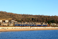 Scotrail Class 158 No 158730 & Class 170 No 170396 skirt along the beach overlooking the  the Firth of Forth Coast at Burntisland, Fife on 6.12.23 with 1L79 1038 Edinburgh to Perth service