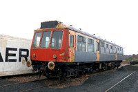 Class 107 DMU DMCL No SC52029 in Strathclyde PTE orange and black livery bought from Glos & Warks awaits renovation at Kirkland Yard,  Fife Heritage railway, Leven on 9.12.23