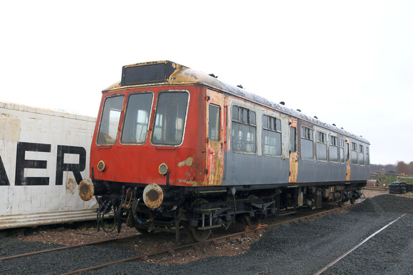 Class 107 DMU DMCL No SC52029 in Strathclyde PTE orange and black livery bought from Glos & Warks awaits renovation at Kirkland Yard,  Fife Heritage railway, Leven on 9.12.23