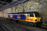 GBRf Class 92 No 92043 'Andy Withers' waits at Edinburgh Waverley Station on 10.12.23 to take over a later Caledonian Sleeper service