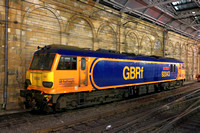 GBRf Class 92 No 92043 'Andy Withers' waits at Edinburgh Waverley Station on 10.12.23 to take over a later Caledonian Sleeper service to London Euston