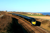 Grand Central Class 180 unit No 180105 heads along the beautiful Durham Coast south of Seaham on 11.11.24 with 1A65 1230 Sunderland to London Kings Cross service