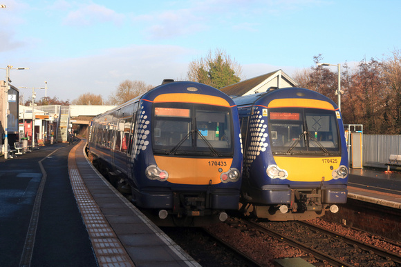 Scotrail Class 170 action at Inverkeithing Station on 14.12.23. 170433 waits with 1L33 1200 Edinburgh to Dundee service, 170425 with 1L74 1115 Perth to Edinburgh service