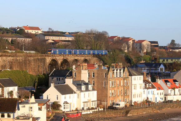 Scotrail Class 170  No 170433 crosses Kinghorn Viaduct, Fife overlooking Pettycur Bay, about to enter Kinghorn station on 14.12.23 with 1L32 0942 Dundee to Edinburgh service