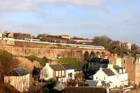 LNER Azuma Class 800 No 800104 crosses Kinghorn Viaduct, Fife overlooking Pettycur Bay, heading north from Kinghorn station on 14.12.23 with 1W02 0708 Leeds to Aberdeen service