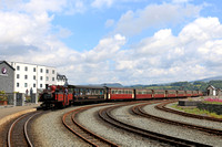 Double Fairlie 'David Lloyd George' arrives at Porthmadog station, Ffestiniog and Welsh Highland Railways line on 16.6.24 with 1245 'Mountain Spiirit' service from Bl. Ffestiniog