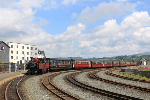 Double Fairlie 'David Lloyd George' arrives at Porthmadog station, Ffestiniog and Welsh Highland Railways line on 16.6.24 with 1245 'Mountain Spiirit' service from Bl. Ffestiniog