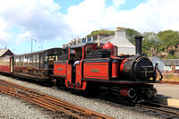 Double Fairlie 'David Lloyd George' with Pullman observation car 150 'Gwynedd' at Porthmadog station on 16.6.24 on the Ffestiniog and Welsh Highland Railways line