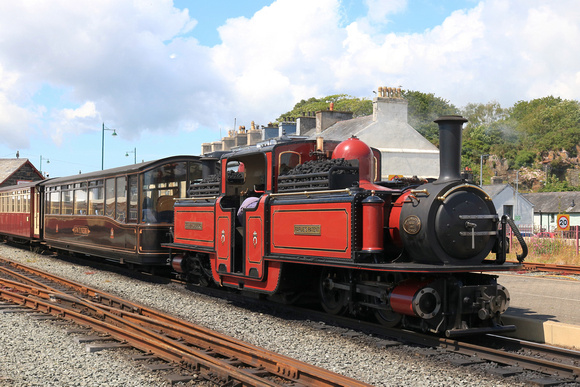 Double Fairlie 'David Lloyd George' with Pullman observation car 150 'Gwynedd' at Porthmadog station on 16.6.24 on the Ffestiniog and Welsh Highland Railways line