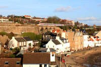 LNER Azuma Class 800 No 800113 crosses Kinghorn Viaduct, Fife overlooking Pettycur Bay, heading into Kinghorn station on 21.12.23 with  1E15 0952 Aberdeen to London Kings Cross service