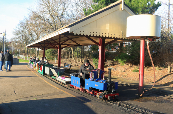 Downs Light Railway 'Brock' at Lakeshore Railroad Miniature Railway, South Shields with a festive train on 24.12.23 abouit to depart for another circuit of the lake