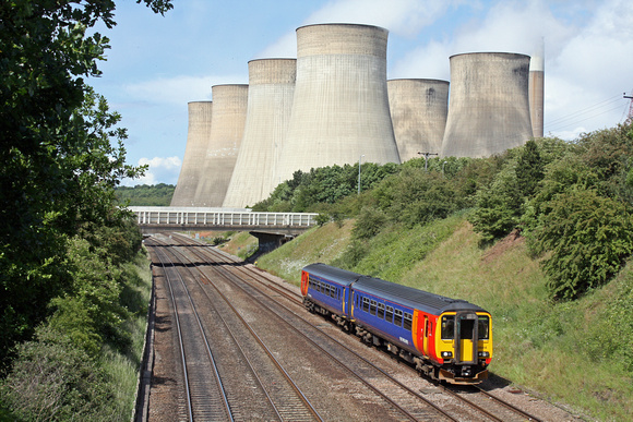 EMT 156414 at Ratcliffe, MML heading towards Loughborough on 8.6.11 with 13.40 Lincoln Central - Leicester service. In th ebackground are the cooling towers of Ratcliffe PS
