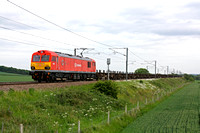 92009 recently repainted in DB Schenker livery is seen at Frinckley Lane, Marston north of Grantham, ECML on 1.6.11 with 4E32 1152 Dollands Moor - Scunthorpe  empty steel carriers