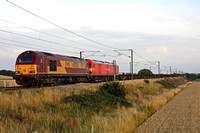 KX Thunderbird 67025 drags failed 92042 at Frinckley Lane, Marston near Grantham ECML on 2.8.11 with 4E32 1152 Dollands Moor - Scunthorpe empty steel carriers. The 92 had failed at Welwyn Garden City