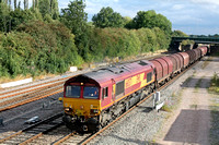 66037 at Trowell  on the Erewash Valley Line heads north on 8.8.11 with 6E79  Wolves - Scunthorpe empty steel carriers