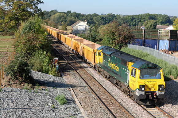 70010 at Whetsone heading towards Wigston South Junction on 28.9.11 with 6U76 0803 Basford Hall - Mountsorrel empty yellow Network Rail IOA wagons