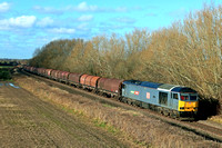 DB Cargo Class 60 No 60074 ' Luke' passes Barrow upon Trent on 9.1.24 with 6E01 1005 Wolverhampton Steel Term to Boston Sleaford Sidings empty steel carriers. Currently only two DB Class 60's are work