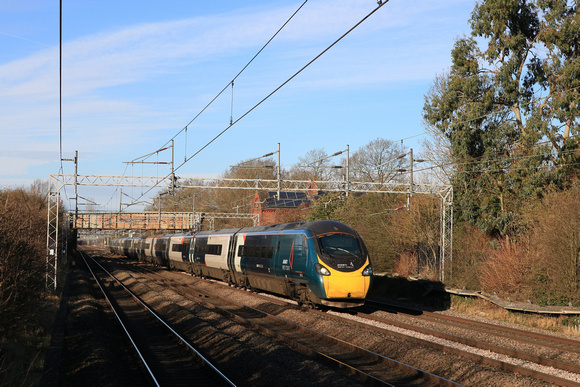 Avanti West Coast  Class 390 Pendolino No 390128 dashes past Cathiron near Rugby, WCML on 16.1.24 with 1A29 1055 Manchester Piccadilly to London Euston service