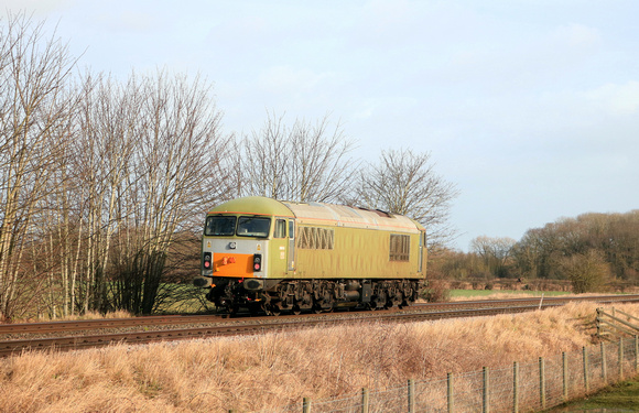 Converted GBRF 69010 (the former 56065) in Undercoat passes Rearsby heading towards Melton Mowbray on 24.1.24 with 0Z73 1124 Leicester L.I.P. to Corby route learning