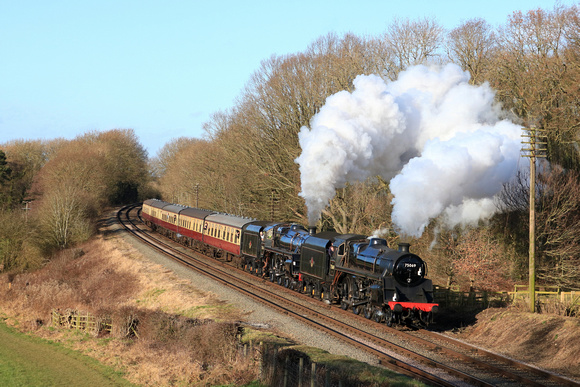 Guest loco BR Standard 4 Locomotive 75069 &Home loco BR Standard Class 5 73156 pass Kinchley Lane on 26.1.24 with 1345 Loughborough to Leicester North service at GCR Winter Steam Gala 2024