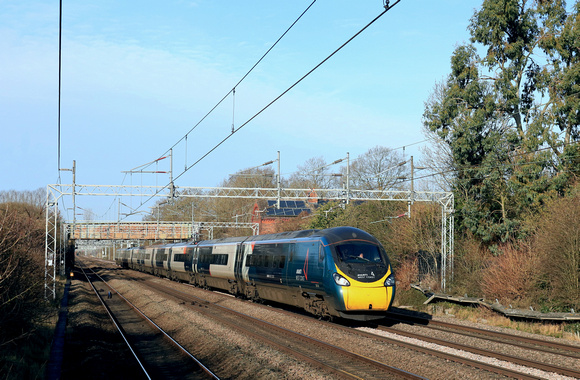 Avanti West Coast  Class 390 Pendolino No 390043 races past Cathiron, WCML. heading towards Rugby on 1.2.24 with 1A29 1055 Manchester Piccadilly to London Euston service