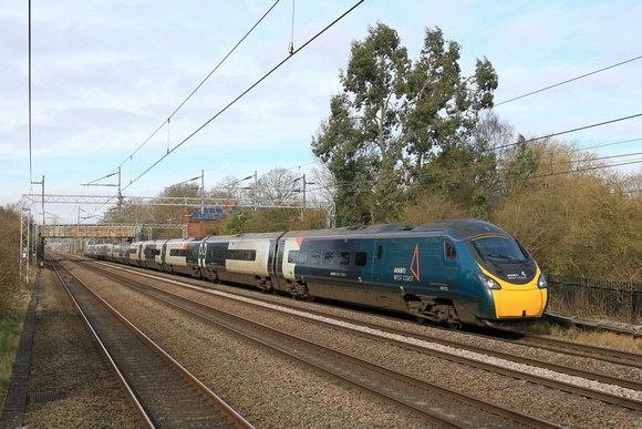 Avanti West Coast  Pendolino Class 390 No 390132 passes Cathiron near Rugby, on the slowline due to engineering works, on 25.2.24 with 1A12 0835 Liverpool Lime Street to London Euston 106 mins late ru