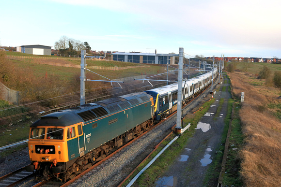GBRf Class 47 No 47727 drags SWR unit No 701012 passes a much changed Kibworth Beauchamp scene from Wistow Road Bridge, MML on 1.3.24 with 5Q24 1155 Eastleigh Trsmd to Derby Litchurch Lane move in low