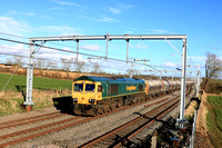 Freightliner Class 66 No 66620 races past Kilby Bridge. Wigston, MML on 1.3.24 with 6M91 1110 Theale Lafarge Fhh to Hope (Earles Sidings) Fhh empty cement tanks