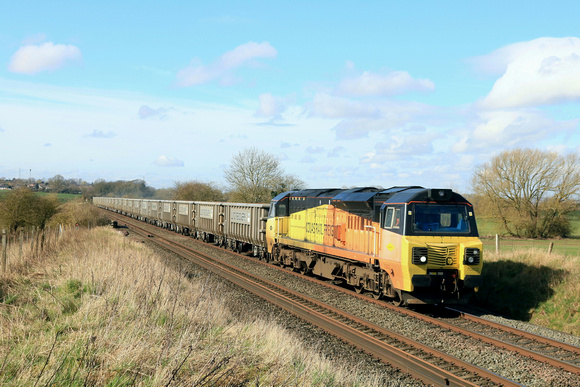 Colas Rail Class 70 No 70802 at Copley's Brook, on the outskirts of Melton Mowbray on 4.3.24 with 6L40 0840 Longport Lr Colas to Whitemoor Yard L.D.C Gbrf empty Land Recovery Ltd JNA Megaboxes for rec