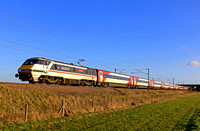 LNER 91119 'Bounds Green Intercity Depot' in special historical Swallow Intercity livery storms north at Burn, ECML on 15.1.20 with 1S18 1300 London Kings Cross to Edinburgh service