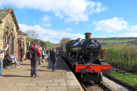 GCR guest loco GWR modified Hall 4-6-0 No.6990 'Witherslack Hall' at Oakworth station on 24.3.24 with 1110 Keighley to Oxenhope at the K&WVR Steam Gala March 2024 (SMB)