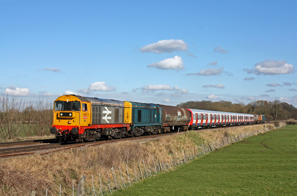Railfreight livery 20132 with blue livery 20107 leads 20314 & 20096  at rear past Rearsby nr Syston East Junction on 24.2.16 with 7X09 1147 Old Dalby - West Ruislip L.U.L. Dept S Stock move