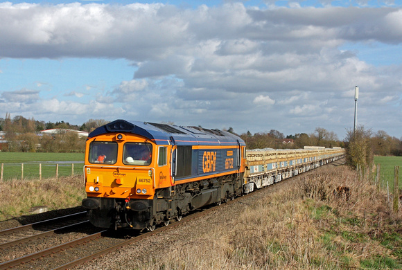 66752 'The Hoosier State' speeds towards Narborough foot crossing on  25.2.16 with 6G16 1123 Cliffe Hill Stud Farm  - Bescot Up Engineers Sdgs loaded MRA side tipping ballast wagons